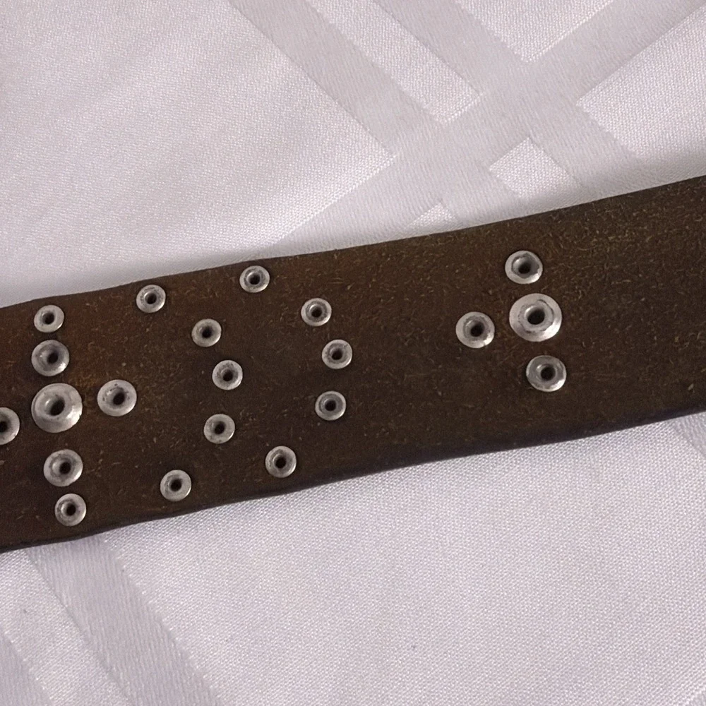 Dark Brown Leather belt with silver buckle and accents. Size XL
